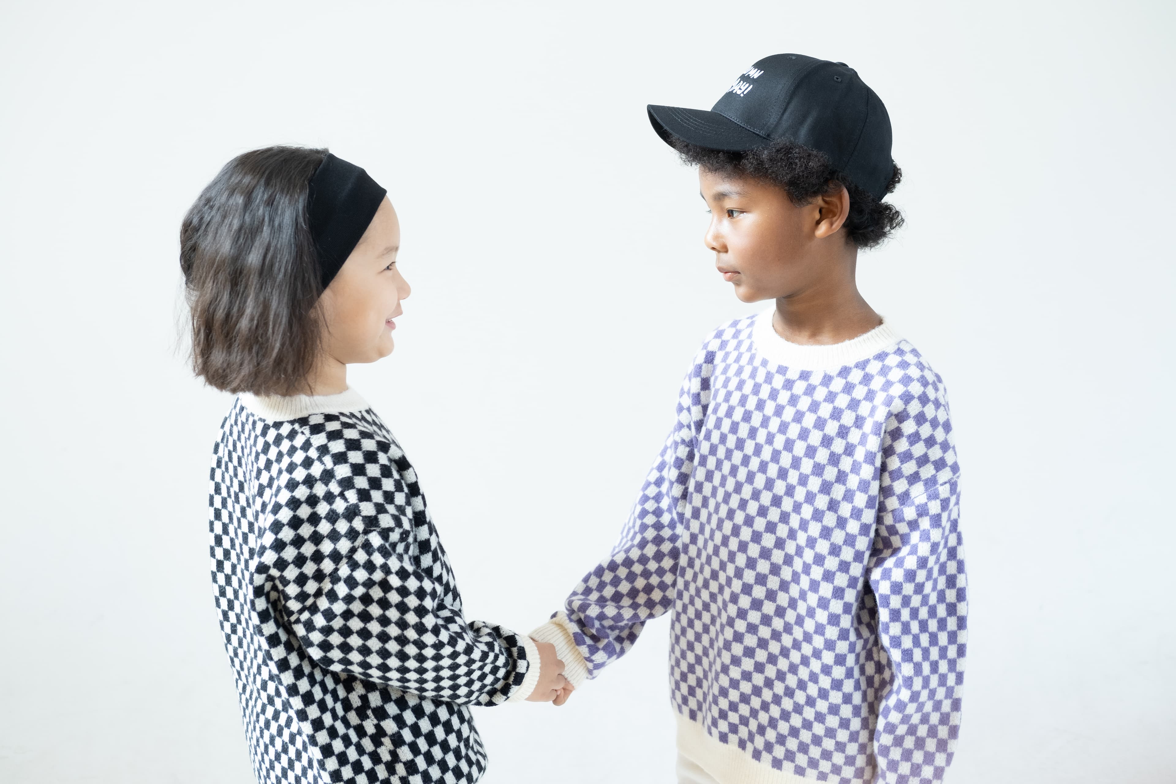 Kids models shaking hands